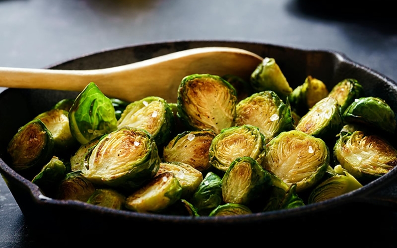 Cooked Brussels Sprouts in cast iron pan