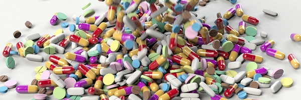 pile of pills of different sizes, shapes, and colors