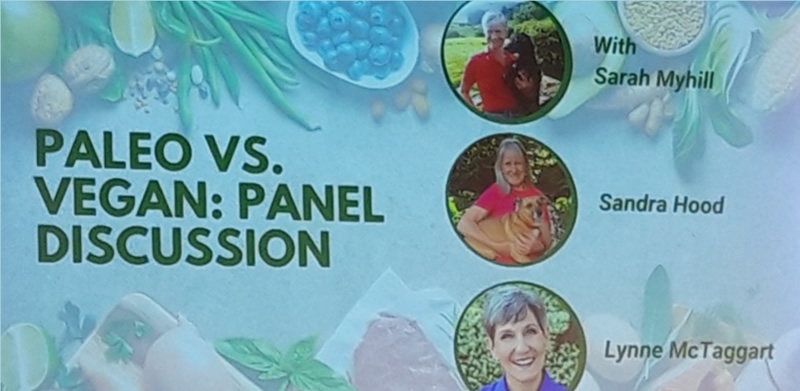 Slide with blue/green background says: Paleo vs Vegan: Panel Discussion with photos of speakers