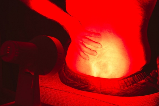 infrared light shining on a man's back