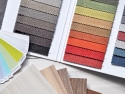Samples of color fabric, paint chips, and wood panel squares.
