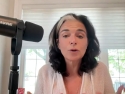 Nathalie Niddam, seated and speaking at microphone.